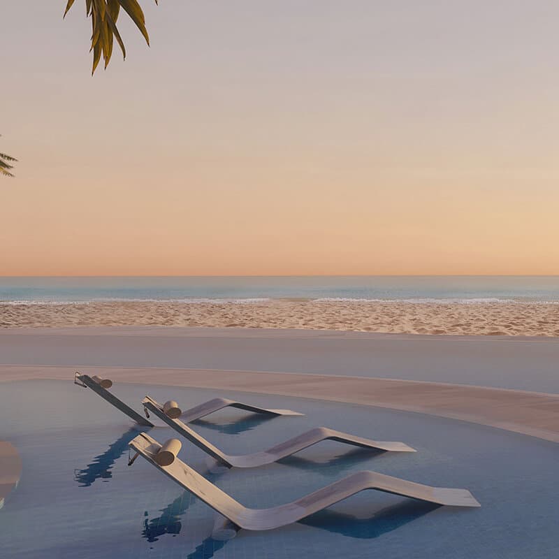 Oceanfront infinity pool at sunset